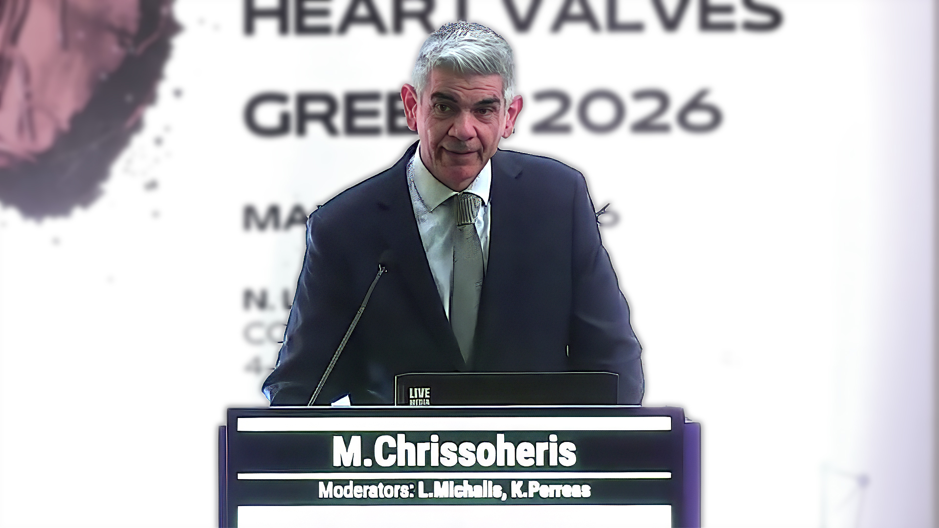 Man standing behind a podium giving a presentation.